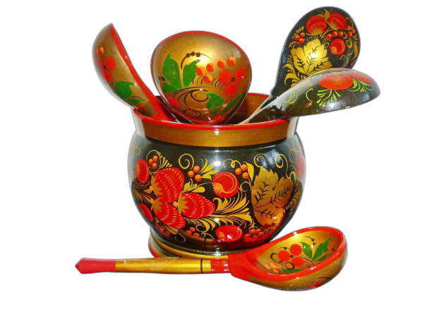 istock Bright wooden kitchen utensils isolated on a white background.  Khokhloma is an ancient Russian folk craft of the XVII century. Traditional elements of Khokhloma are red juicy berries of mountain ash and strawberries 1210695055