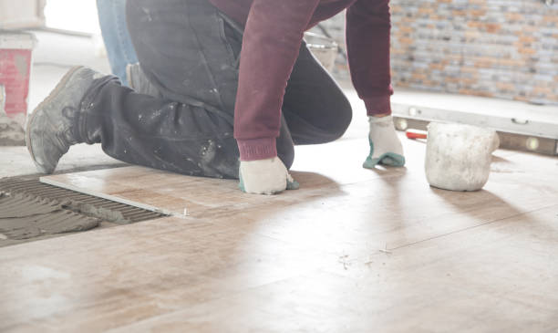 istock Laying floor ceramic tile. Renovating the floor 1210696732