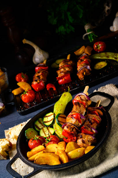 Shish kebab with various vegetables and spice country potatoes