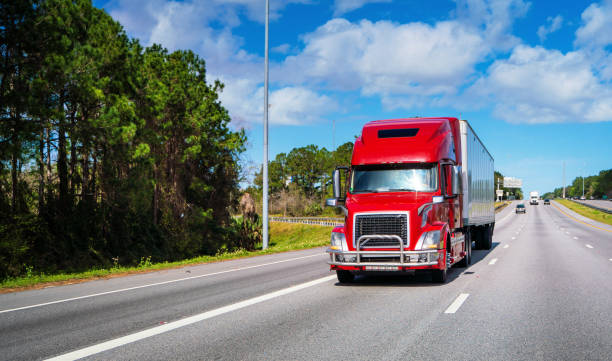 istock Red semi-truck on the highway 1210705919