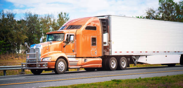 istock Orange semi-truck on the highway 1210705975