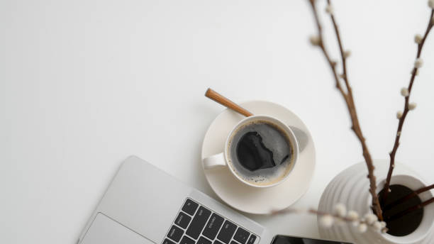 istock Top view of workspace with laptop, coffee cup, decorations and copy space 1210707190