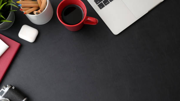 istock Top view of stylish workspace with laptop, coffee cup and copy space 1210707855