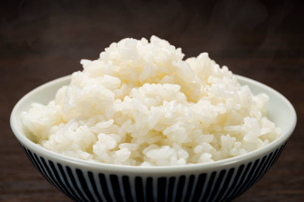 istock Freshly cooked hot rice, in bowl 1210708102