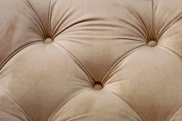 istock Textural rhomb ornament on brown upholstery. Close up. 1210708293