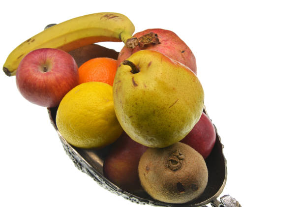 fresh fruits and vegetables  in a basket isolated on white background