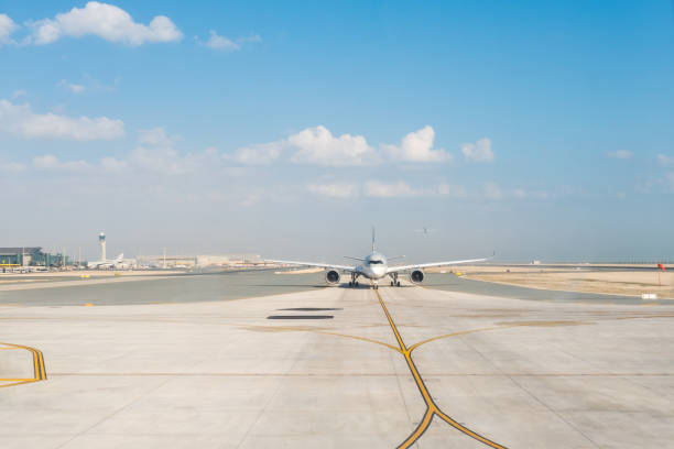 Commercial airliner on runway. Aircraft on the ground before taking off Commercial airliner on runway. Commercial Aircraft plane on the ground before taking off taxiway stock pictures, royalty-free photos & images