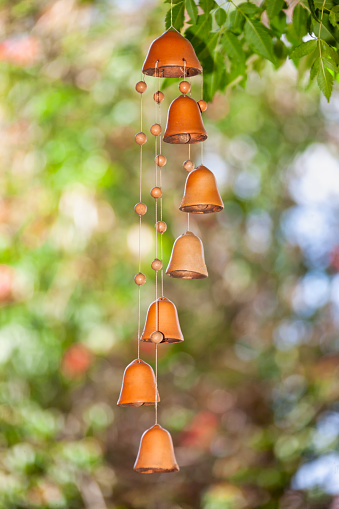 terracotta wind charm  in the garden, summer day relaxation