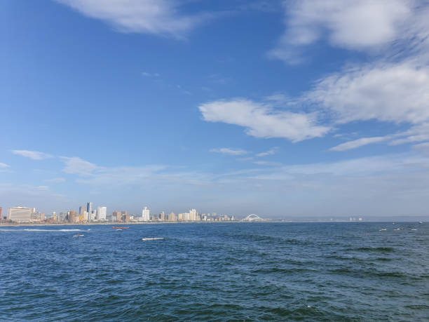istock Scenic with canoes on blue sea. 1210716339