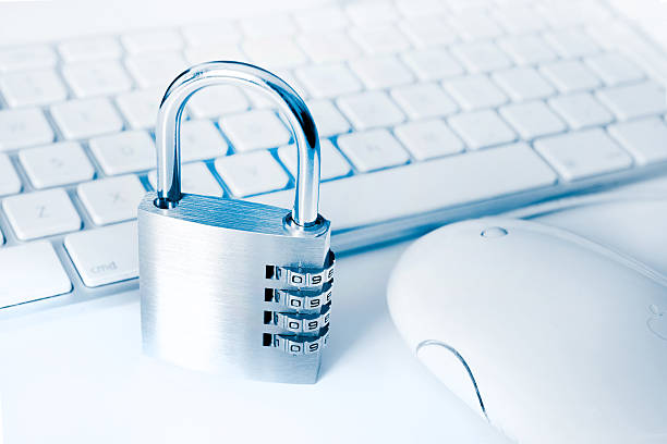 istock White Apple keyboard and mouse, with metal combination lock 121071674