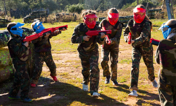 istock Teams of kids facing on battlefield 1210720393