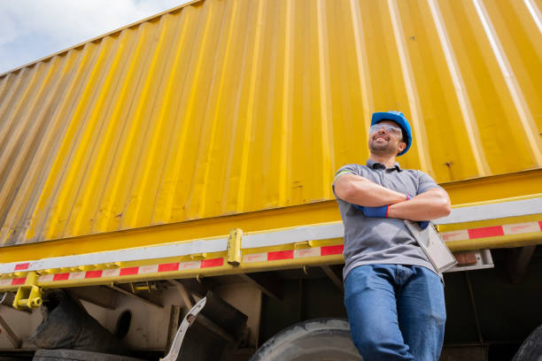 istock Man working in a warehouse scoring while receiving a truck 1210721604