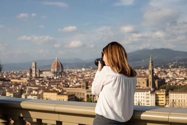 istock Young photographer capturing cityscape 1210723830