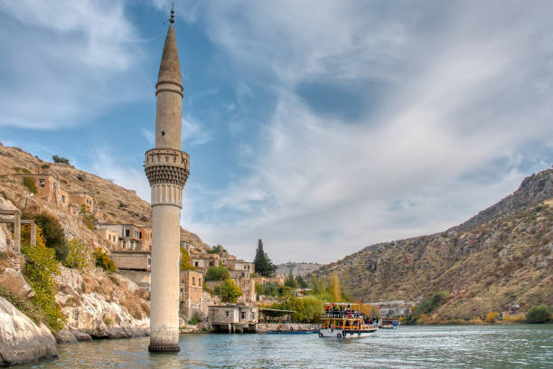 Minaret of the mosque in the water of the dam Minaret of the mosque in the water of the dam halfeti stock pictures, royalty-free photos & images