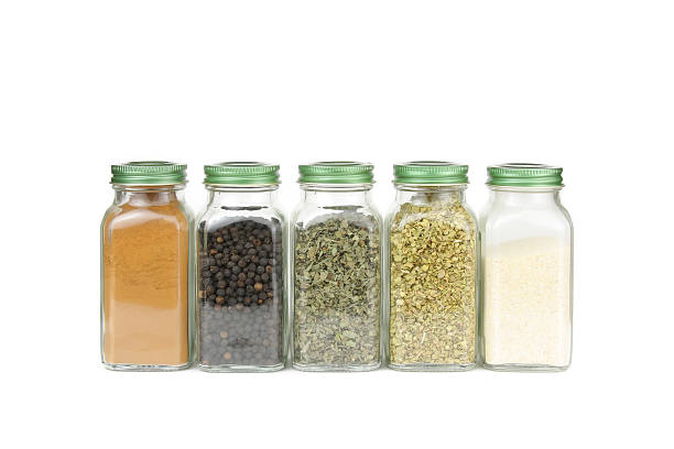 Spices in glass containers Spices in glass containers spice rack stock pictures, royalty-free photos & images