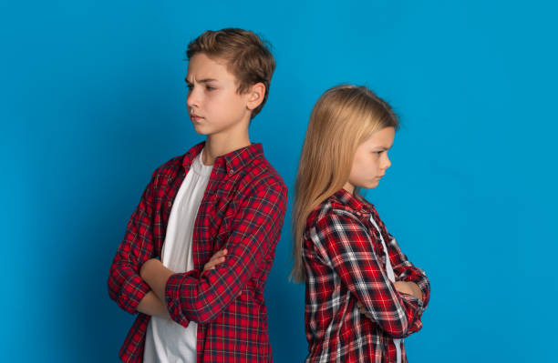 istock Siblings Misunderstanding. Offended Brother And Sister Ignoring Each Other After Quarrel 1210728608