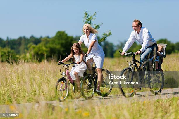 Family Cycling Outdoors In Summer Stock Photo - Download Image Now - Cycling, Family, Bicycle