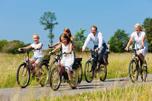 istock Family cycling outdoors in summer 121073072