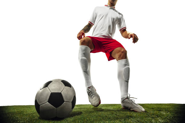 istock Football or soccer player on white background - motion, action, activity concept 1210731150