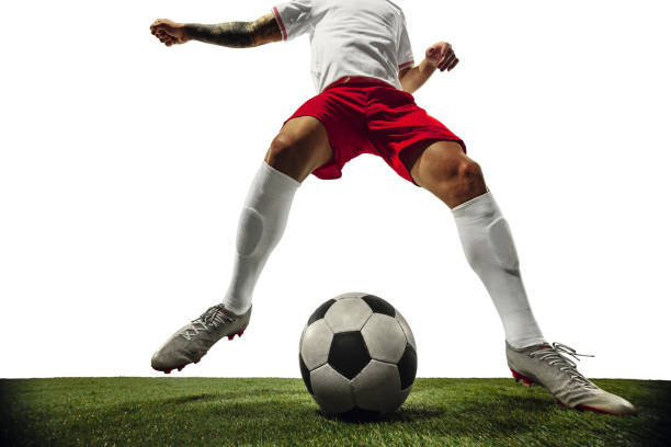 istock Football or soccer player on white background - motion, action, activity concept 1210731151