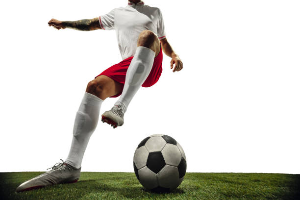 istock Football or soccer player on white background - motion, action, activity concept 1210731159