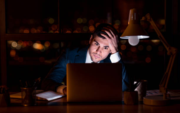istock Entrepreneur At Laptop Thinking On Business Idea Overnight In Office 1210731725
