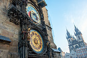 Astronomical clock in Old Town of Prague with Tyn church.
