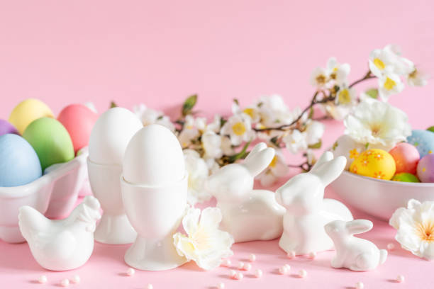 istock Easter holiday decorations on pink background with spring flowers, festive greeting card 1210733479