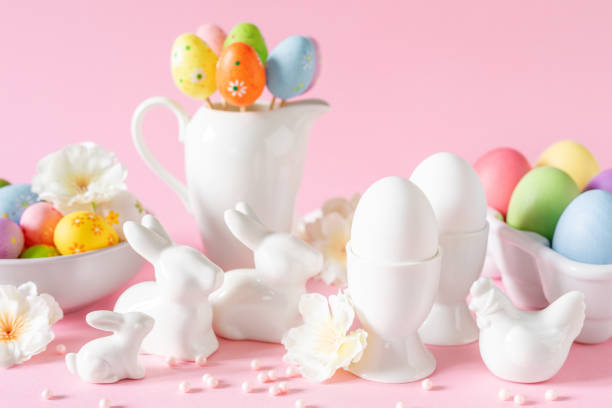 istock Easter holiday decorations on pink background with spring flowers, festive greeting card 1210733619