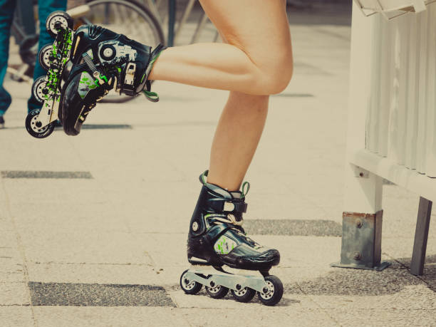 istock Woman legs wearing roller skates 1210733658