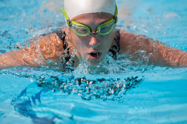 istock Woman Wearing Goggles Swimming In Pool 1210735729