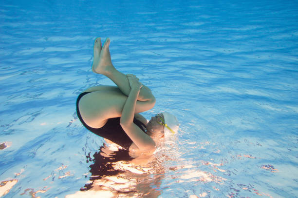 istock Woman Wearing Goggles Swimming In Pool 1210736210