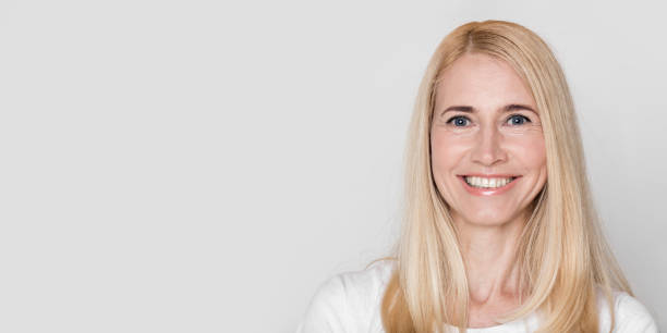 istock Beautiful middle aged woman smiling at camera 1210736807