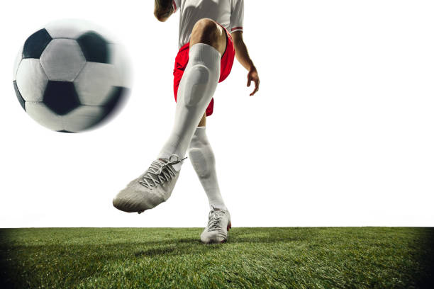 istock Football or soccer player on white background - motion, action, activity concept 1210736929