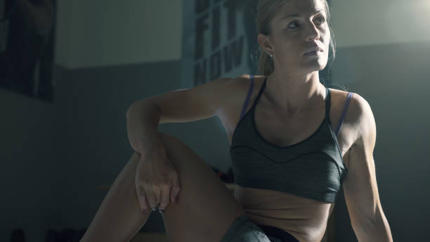 istock Athletic woman doing stretching exercises at the gym 1210737504