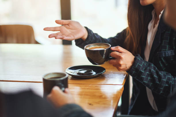 istock people enjoyed talking and drinking coffee together in cafe 1210737998