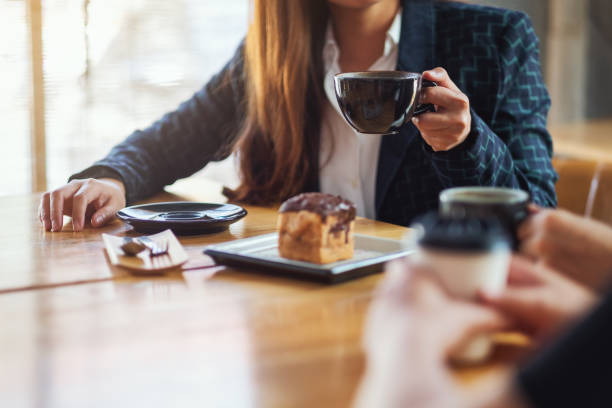 istock people enjoyed talking, eating and drinking coffee together in cafe 1210738059