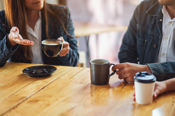 istock people enjoyed talking and drinking coffee together in cafe 1210738062