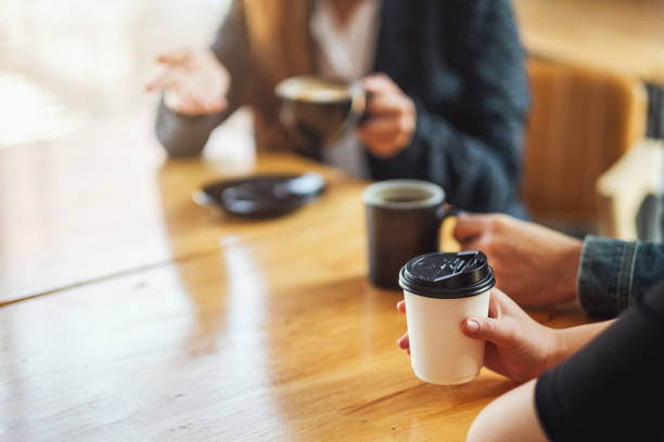 istock people enjoyed talking and drinking coffee together in cafe 1210738127