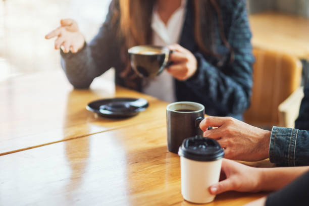 istock people enjoyed talking and drinking coffee together in cafe 1210738153