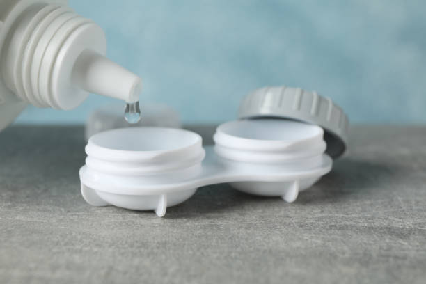 istock Case for contact lenses and liquid on grey table, close up 1210738202