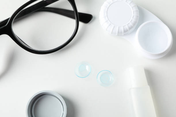istock Glasses, contact lenses, liquid and case on white background, top view 1210738568