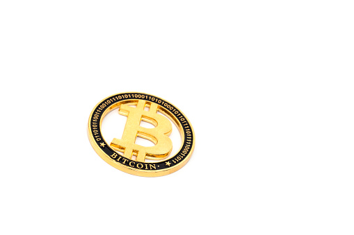gold bitcoin physical isolated on white background.