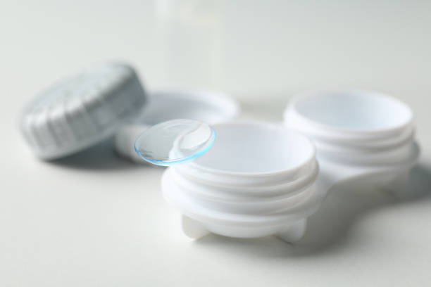 istock Contact lenses and case on white background, close up 1210739342