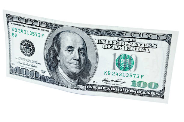 istock hundred dollars isolated on white close up look 1210739456