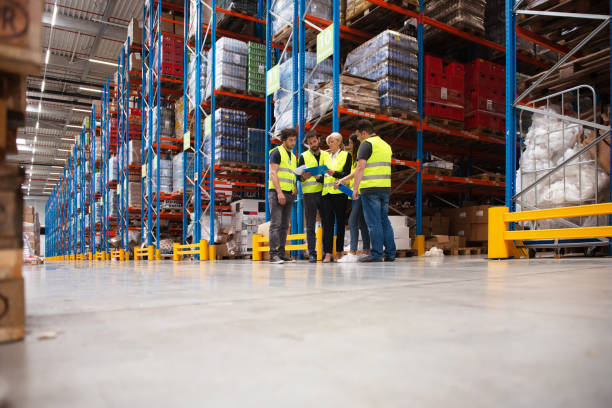 istock Warehouse staff meeting, workers with mnagers 1210740237