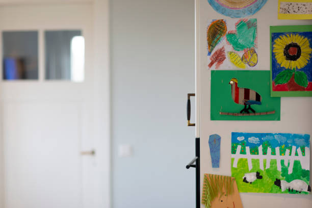 istock Kitchen wall with drawings made by kids 1210741017