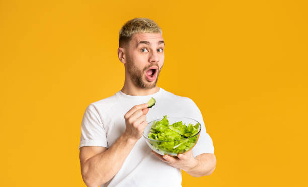 istock Healthy eating concept. Surprised guy with open mouth 1210741365