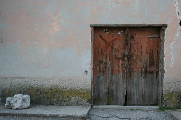 istock Stone wall and wood door 1210742357