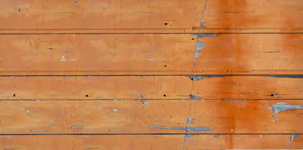 Old wood board painted orange, banner background texture